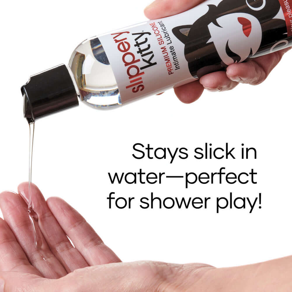 Slippery Kitty Silicone Lubricant 4 Oz pouring from bottle into hand showcasing water play suitability.