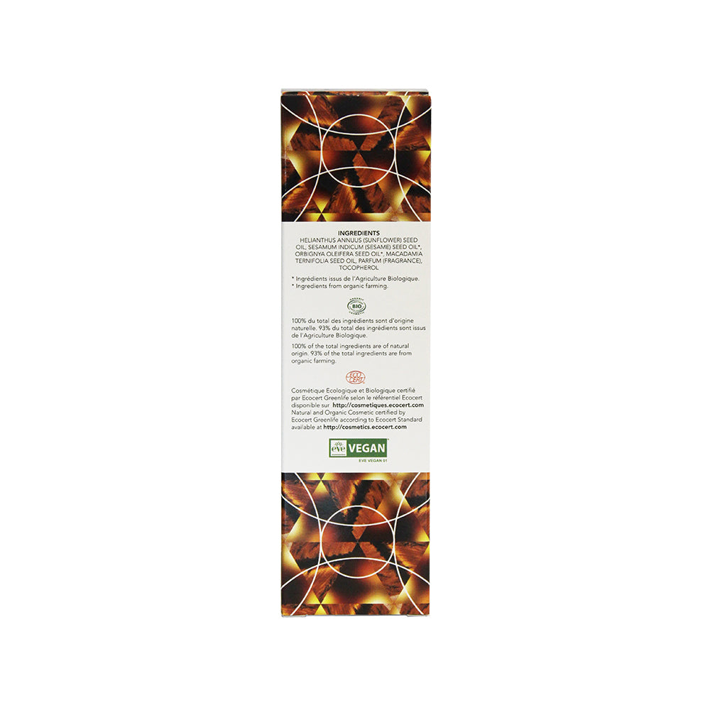 Exsens Body Oil Tiger Eye Macadamia 3.4 Oz ingredient list and packaging details on the back of the bottle.