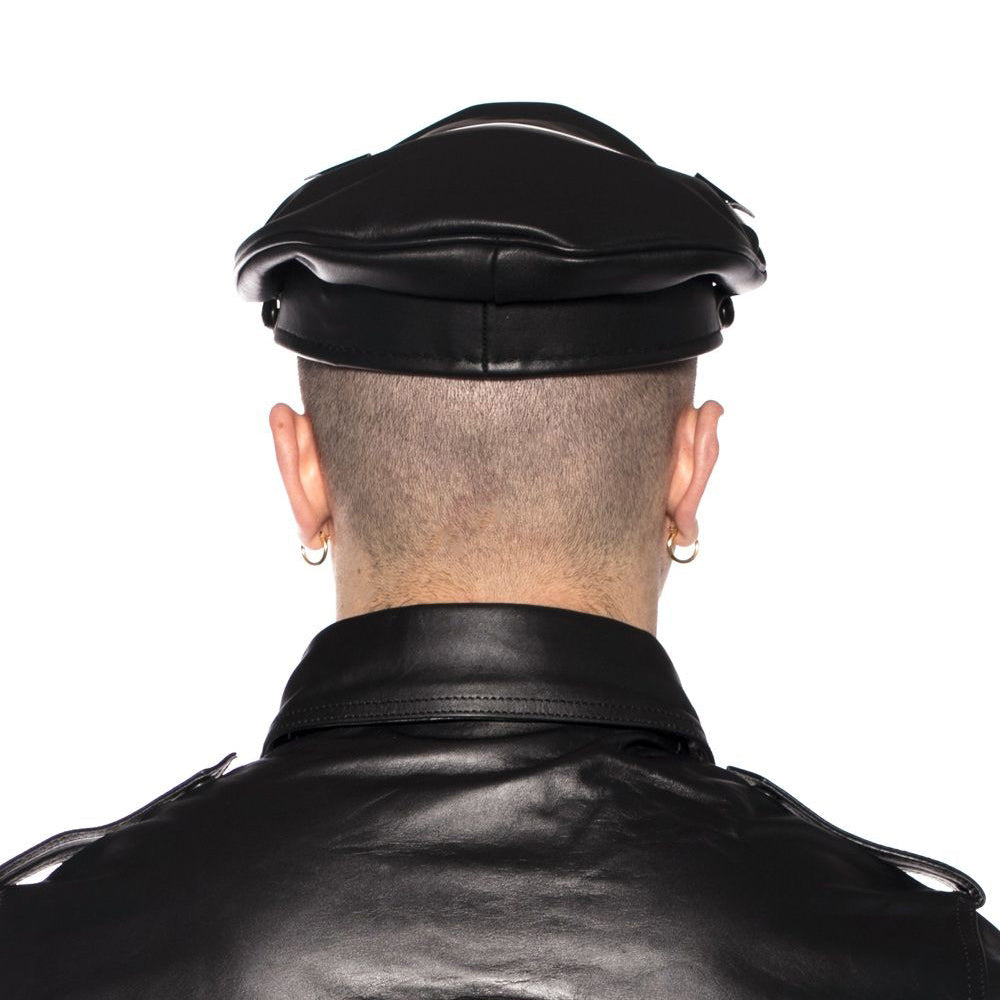 Back view of a person wearing the Prowler RED Military Cap Black Large 59cm with a leather jacket.