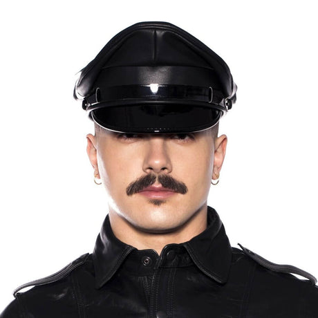 Model wearing Prowler Red Military Cap Black 61cm XL with leather outfit and striking mustache.