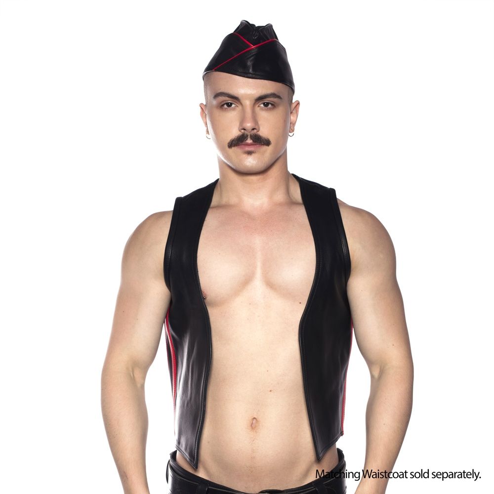 Model showcasing the Prowler Red Triangle Cap Black Red 55 cm Small with a black leather vest, highlighting bold fetish fashion.