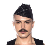 Prowler RED Triangle Cap Grey 61cm XL worn by a man, showcasing a stylish leather look with a bold design.
