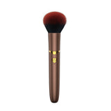 The Pleasure Company Brush Vibrating Bullet Gold brush with soft bristles and gold accents, perfect for discreet stimulation.