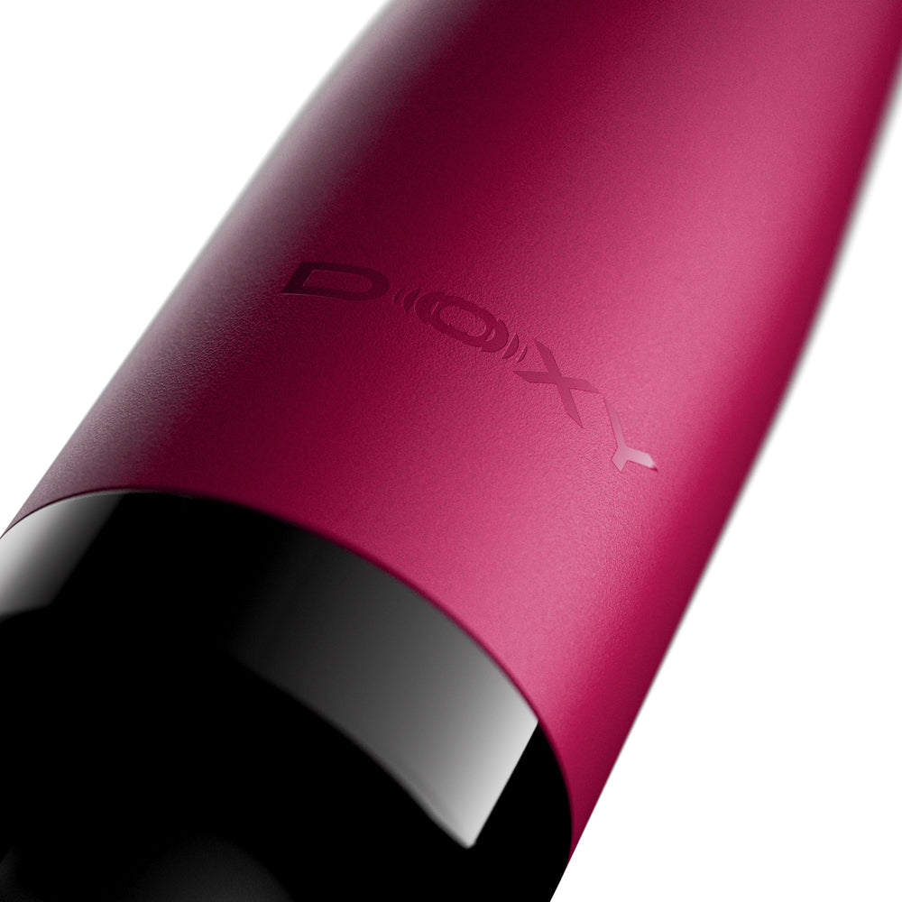 Close-up of the Doxy Original Massager Wand Massager Pink showcasing its elegant design and signature logo.
