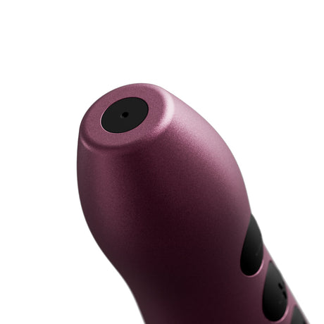 Doxy Go Travel-sized Wand Massager Pink close-up view showcasing its compact design and anodized aluminum finish.