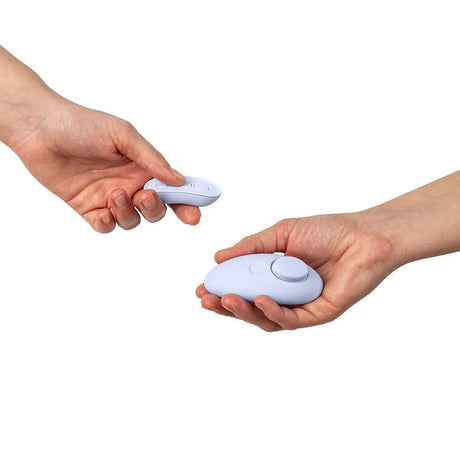 Dame Lay Panty Vibrator With Remote Control held in hands, showcasing its portable and discreet design.
