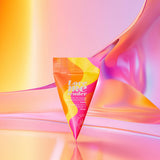 Love To Love Love Me Tender Heating Massage Oil Vanilla packaging against a colorful gradient background.