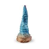 Camtoyz Fantasy Dildo Vortex in vibrant red, blue, and gold colors, showcasing its unique design and artistic aesthetics.