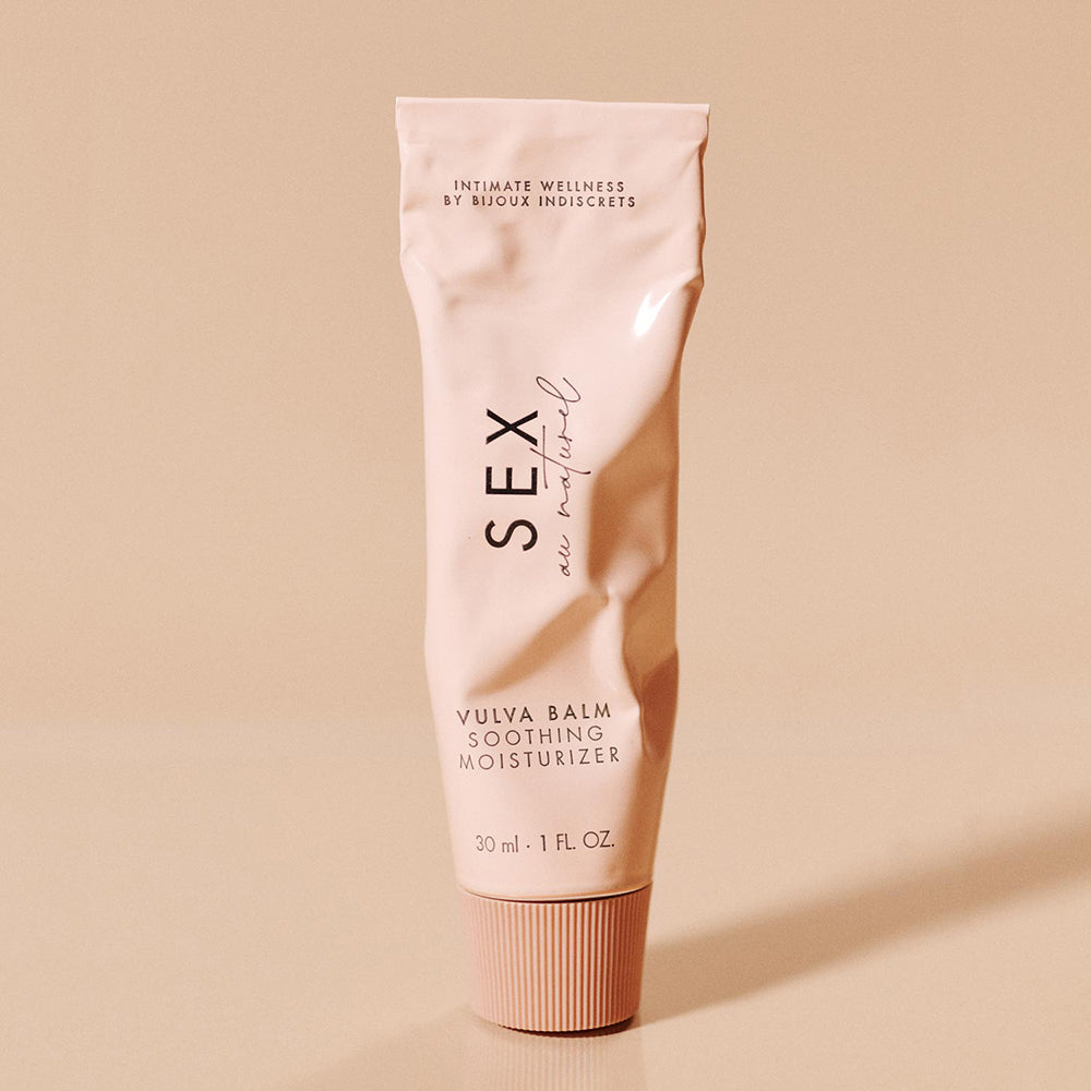 Sex Au Naturel Vulva Balm Soothing Moisturizer tube on a minimalist background