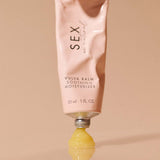 Sex Au Naturel Vulva Balm Soothing Moisturizer tube with yellow balm oozing out, providing hydration and comfort.