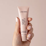 Sex Au Naturel Vulva Balm Soothing Moisturizer in a hand, showcasing its soothing packaging for intimate care.