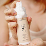 Sex Au Naturel Prebiotic Intimate Wash Gentle Foam in hand dispensing gentle foam.