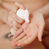 Sex Au Naturel Prebiotic Intimate Wash Gentle Foam being dispensed into a hand for gentle cleansing.