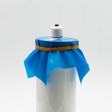 Bananakit Complete DIY Vibrating Kit Pink with blue cover and rubber band on top.