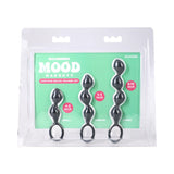 Mood Naughty Contour Beads Trainer Set Black featuring silicone butt plugs in three sizes: 4.5, 5.5, and 6.75 inches.