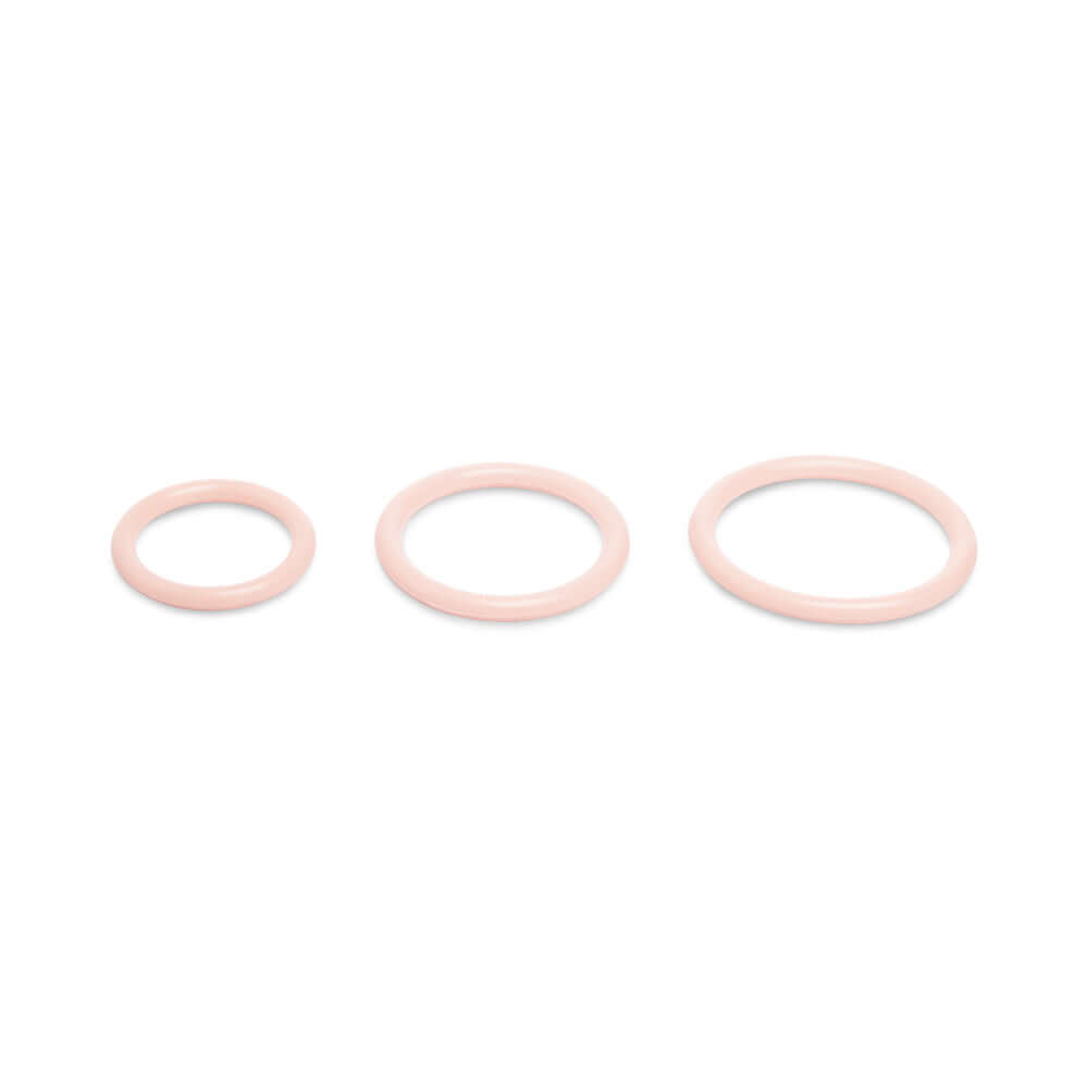 Together Toy Nudefit Strap-on Harness Light accessory rings set in soft pink, showcasing three different sizes for versatile use.
