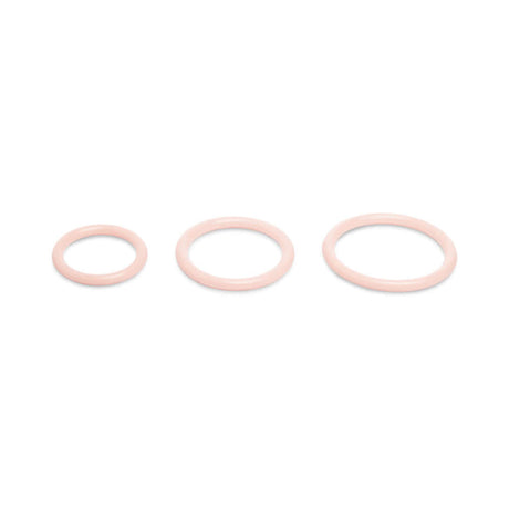 Together Toy Nudefit Strap-on Harness Light accessory rings set in soft pink, showcasing three different sizes for versatile use.