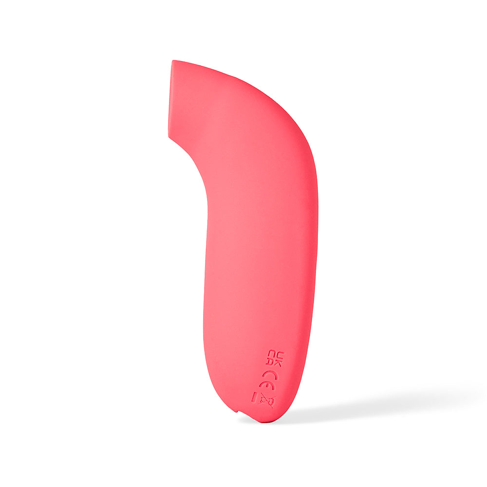 Dame Aer Suction Massager Coral in a vibrant coral color, featuring an innovative design for self-pleasure.