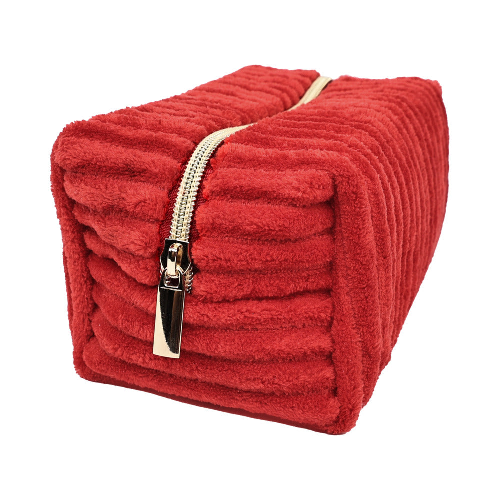 Adam & Eve Eve's Plush Toy Storage Bag in plush red fabric with a gold zipper, perfect for discreet storage.