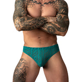 Male Power Ripple Moon Jock Teal S/M on a tattooed model, showcasing its modern wavy lace design.