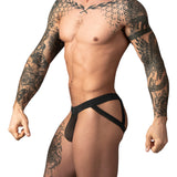 Male Power Mesh 2.0 Strappy Ring Jock Black S M showcased on a muscular model with tattoos.