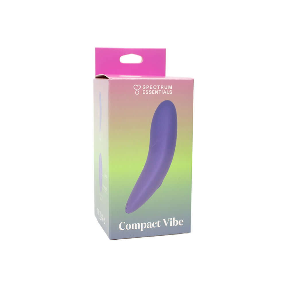 Spectrum Essentials Compact External Vibrator Purple packaging displayed against a gradient background.