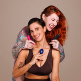 Je Joue Couple's Collection Vibrator Gift Set featured with two women expressing joy and intimacy.