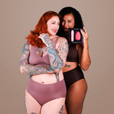 Je Joue Double Trouble Vibrator Set displayed by two women, showcasing the sensual product and promoting refined pleasure.