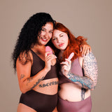 Je Joue Double Trouble Vibrator Set showcased by two women holding vibrators, promoting sensual pleasure and body positivity.