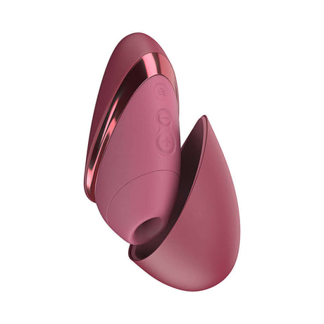 Womanizer Next Liberty Air Clitoral Massager Bordeaux in compact design with travel cap.