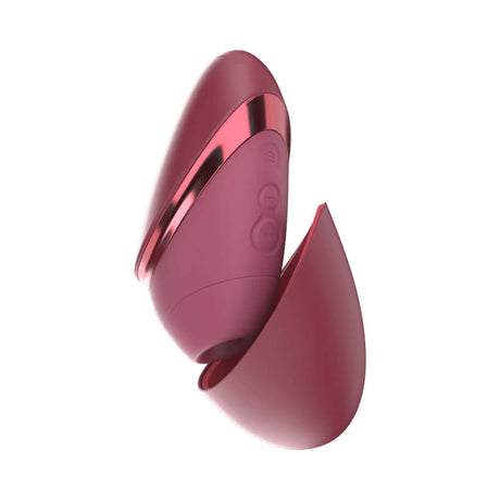 Womanizer Next Liberty Air Clitoral Massager Bordeaux in a sleek design for portable pleasure.