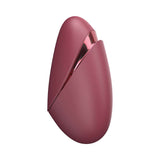 Womanizer Next Liberty Air Clitoral Massager Bordeaux in sleek bordeaux design with travel cap for convenient use.