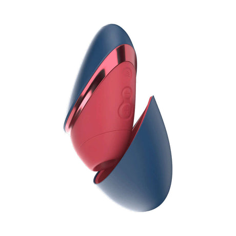 Womanizer Next Liberty Air Clitoral Stimulator Blue Red in a compact design with a travel cap.