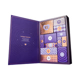 Lovehoney Indulge Advent Calendar 2026 (12 Day) open showcasing colorful numbered doors and festive design.