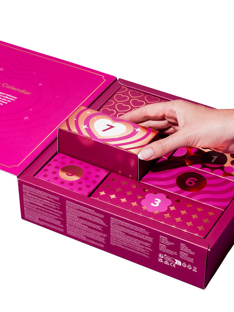 Lovehoney X We-Vibe 7 Day Romance Advent Calendar with a hand reaching for the seventh door.