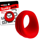 Oxballs Hunkyjunk Expander Slimmer Scoop Style Cockring Red with packaging showing its ergonomic design.