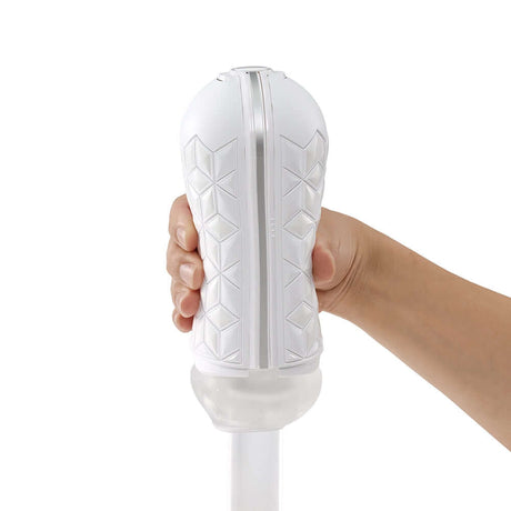 Hand holding the Tenga Flip Flexy Male Stroker showcasing its spiral-ribbed design and innovative material.