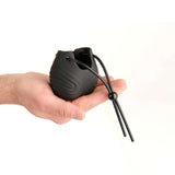 Prowler Red Vibrating Ball Bag held in hand, highlighting its body-safe silicone design and adjustable cord.