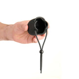Hand holding the Prowler Red Vibrating Ball Bag, showcasing the design and adjustable closure.