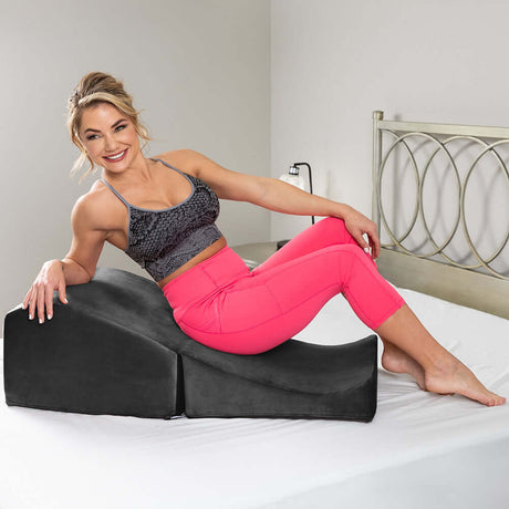 Liberator Flip Ramp With Slip Cover Lush Black in use as a supportive cushion for versatile positioning.