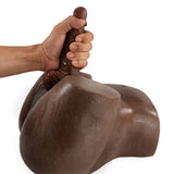 Camtoyz Raw Torso Naysa Piel Oscura Chocolate with realistic texture and sculpted details in hand.