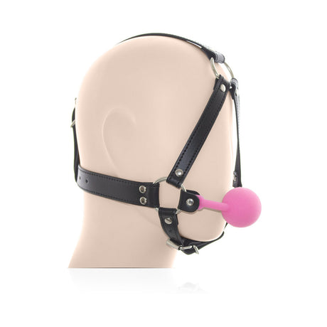 Ple'sur Face Harness Ball Gag Pink displayed on a mannequin head emphasizing its playful and structured design.