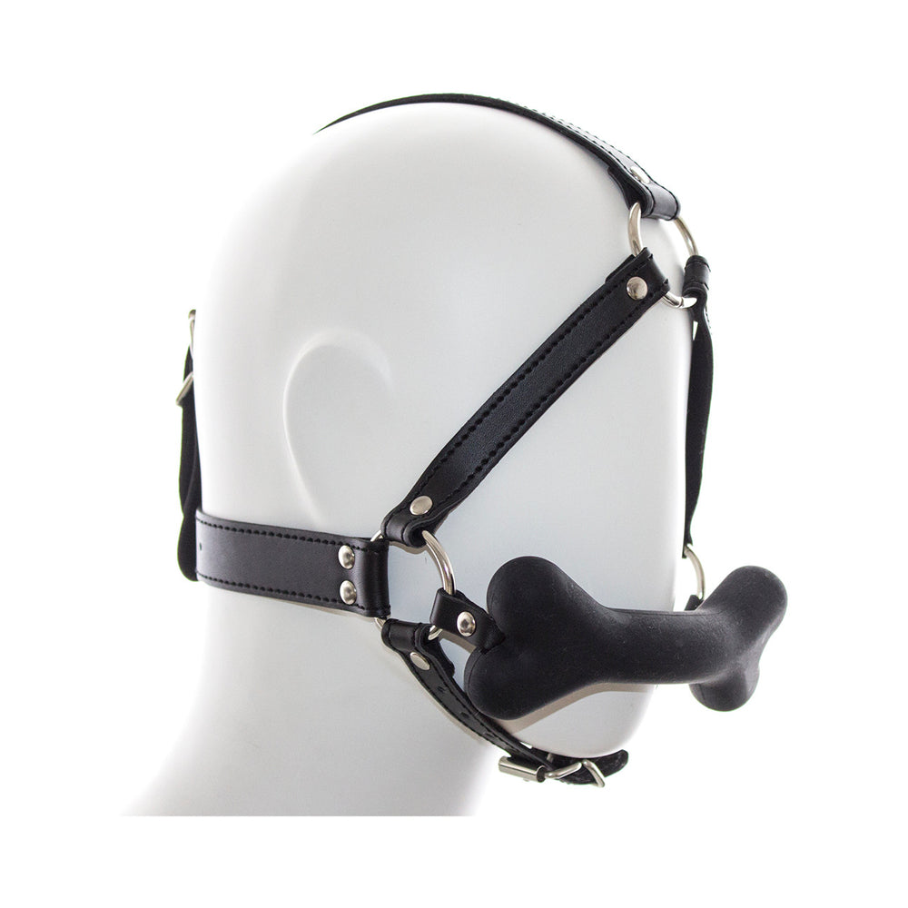 Ple'sur Face Harness Dog Bone Gag featuring a black harness and playful bone-shaped bit for pup play.