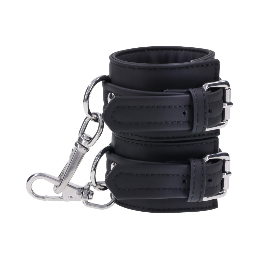 Sportsheets Signature Midnight Muse Handcuffs featuring soft silicone material and sleek silver hardware for refined restraint play.