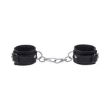 Sportsheets Signature Midnight Muse Handcuffs in black silicone with silver hardware for sophisticated restraint play.