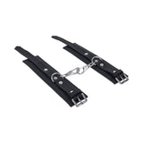 Sportsheets Signature Midnight Muse Handcuffs with soft silicone and sleek silver hardware for refined restraint play.
