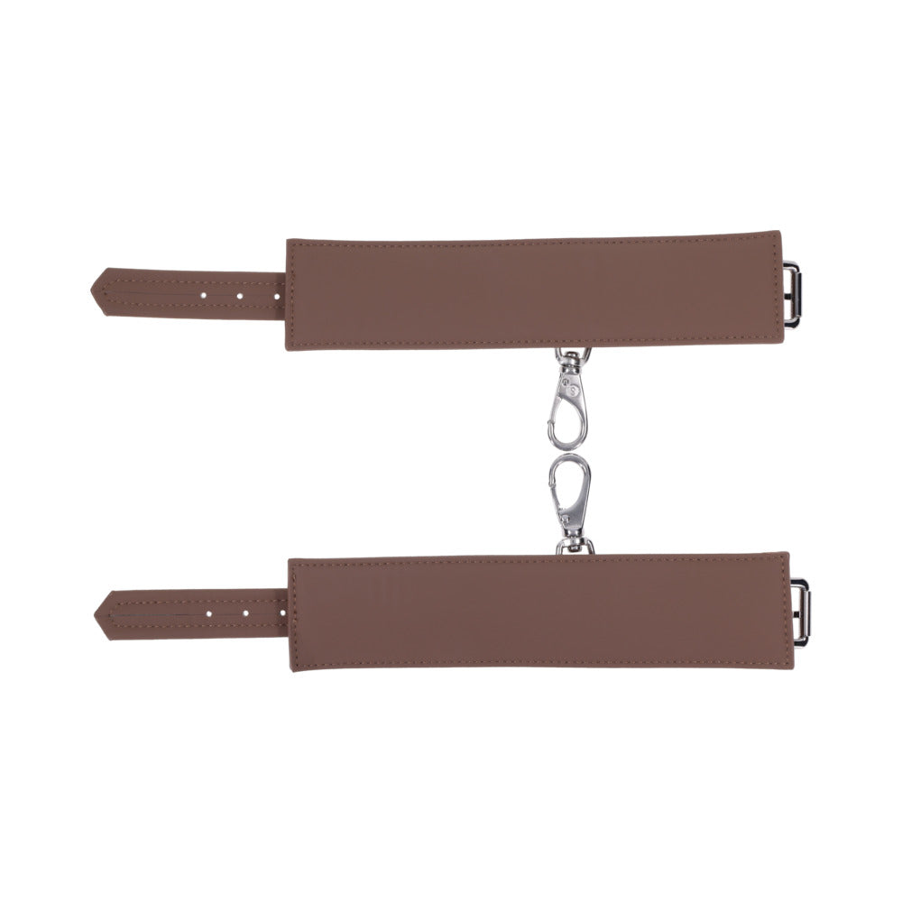Sportsheets Signature Dawn Dream Handcuffs featuring soft silicone with silver hardware for comfortable restraint play.