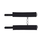Sportsheets Signature Midnight Muse Ankle Cuffs in sleek black silicone with silver-tone hardware for comfortable restraint play.