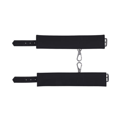 Sportsheets Signature Midnight Muse Ankle Cuffs in sleek black silicone with silver-tone hardware for comfortable restraint play.
