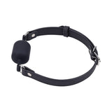 Sportsheets Signature Midnight Muse Barrel Gag showcasing the sleek cylindrical design and luxurious black strap.
